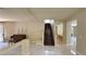 Hallway with tiled floor and view of staircase at 6778 Goose Watch Ct, Las Vegas, NV 89139