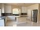 Modern kitchen with stainless steel appliances, granite countertops, and a tile backsplash at 6778 Goose Watch Ct, Las Vegas, NV 89139