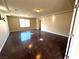 Bright, open living room with wood floors and neutral walls at 6778 Goose Watch Ct, Las Vegas, NV 89139