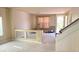 Spacious living room with tile flooring, natural light, and staircase to the second level at 6778 Goose Watch Ct, Las Vegas, NV 89139