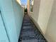 This side yard features a walkway constructed of stones and small pebbles at 6778 Goose Watch Ct, Las Vegas, NV 89139
