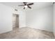 Neutral bedroom features tile flooring, ceiling fan, and closet at 6868 Sky Pointe Dr # 1122, Las Vegas, NV 89131