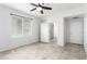 Clean bedroom with tile floors, en suite bathroom, and ceiling fan at 6868 Sky Pointe Dr # 1122, Las Vegas, NV 89131