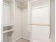 Bright walk-in closet offers ample storage space with rods and shelving at 6868 Sky Pointe Dr # 1122, Las Vegas, NV 89131