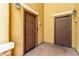 Close-up of two brown front doors, highlighting private entrances and building architecture at 6868 Sky Pointe Dr # 1122, Las Vegas, NV 89131
