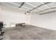 Uncluttered garage features high ceilings and room for storage at 6868 Sky Pointe Dr # 1122, Las Vegas, NV 89131