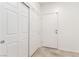 Hallway features tile flooring, closet, and neutral paint at 6868 Sky Pointe Dr # 1122, Las Vegas, NV 89131