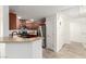 Bright kitchen with stainless steel appliances, wood cabinets, and tile flooring at 6868 Sky Pointe Dr # 1122, Las Vegas, NV 89131