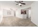 Spacious living room with tile floors and ceiling fan, open to kitchen at 6868 Sky Pointe Dr # 1122, Las Vegas, NV 89131