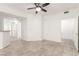 Spacious living room with modern lighting, tile floors, and easy access to other rooms in the home at 6868 Sky Pointe Dr # 1122, Las Vegas, NV 89131