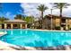 Beautiful community pool, surrounded by palm trees, offers a perfect spot for relaxation and outdoor fun at 6868 Sky Pointe Dr # 1122, Las Vegas, NV 89131