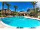 Resort-style pool area with covered seating, palm trees, and lounge chairs for relaxing and enjoying sunny days at 6868 Sky Pointe Dr # 1122, Las Vegas, NV 89131