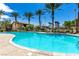Gorgeous community pool surrounded by palm trees offers the perfect spot to cool off and enjoy the sunny weather at 6868 Sky Pointe Dr # 1122, Las Vegas, NV 89131