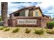 Attractive Sky Pointe community signage on a brick wall with lush landscaping, showing curb appeal at 6868 Sky Pointe Dr # 1122, Las Vegas, NV 89131