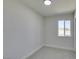 Bright bedroom with neutral carpet, white trim, and a window offering natural light at 709 Rossmoyne Ave, North Las Vegas, NV 89030