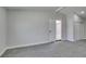 Bedroom featuring new carpet, neutral paint, and bright natural lighting at 709 Rossmoyne Ave, North Las Vegas, NV 89030