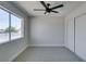 Bedroom features ceiling fan, closet, and window offering natural light at 709 Rossmoyne Ave, North Las Vegas, NV 89030