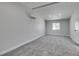 Spacious bedroom with plush carpeting, neutral tones, and ample natural light at 709 Rossmoyne Ave, North Las Vegas, NV 89030