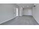 Spacious living room features neutral carpet, white trim, and ample natural light through an open doorway at 709 Rossmoyne Ave, North Las Vegas, NV 89030