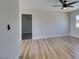 Bright and airy living room with hardwood floors and neutral paint at 709 Rossmoyne Ave, North Las Vegas, NV 89030