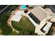 Aerial view of a backyard with a grass lawn, basketball court, swimming pool, and RV parking at 7360 Dolphine Crest Ave, Las Vegas, NV 89129