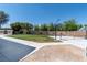 Large backyard featuring a basketball court, shed, and well-maintained landscaping at 7360 Dolphine Crest Ave, Las Vegas, NV 89129
