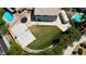 Large backyard featuring grass, a basketball court, a swimming pool, and RV parking at 7360 Dolphine Crest Ave, Las Vegas, NV 89129