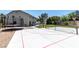 Spacious backyard featuring a basketball court, trampoline, and manicured lawn at 7360 Dolphine Crest Ave, Las Vegas, NV 89129
