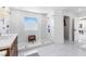 Large bathroom featuring a glass shower, modern fixtures, and tiled floors at 7360 Dolphine Crest Ave, Las Vegas, NV 89129