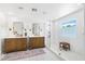 Bright bathroom with walk-in shower, double vanity, marble floors, and modern fixtures at 7360 Dolphine Crest Ave, Las Vegas, NV 89129