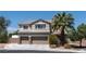 Charming two-story home with a three-car garage and a well-manicured front yard with mature trees at 7360 Dolphine Crest Ave, Las Vegas, NV 89129