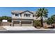 Charming two-story home with a three-car garage and a well-manicured front yard with mature trees at 7360 Dolphine Crest Ave, Las Vegas, NV 89129