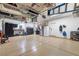 Organized garage with storage solutions, epoxy flooring, and ample space for vehicles at 7360 Dolphine Crest Ave, Las Vegas, NV 89129