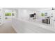 Spacious hallway with white shiplap walls, neutral carpet, and views to adjacent rooms at 7360 Dolphine Crest Ave, Las Vegas, NV 89129