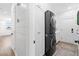 Modern laundry room is equipped with a front-load washer and dryer, plus storage cabinets and ample counter space at 7360 Dolphine Crest Ave, Las Vegas, NV 89129