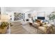 Bright living room features stylish furnishings, built-in shelving, and a neutral color palette at 7360 Dolphine Crest Ave, Las Vegas, NV 89129