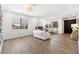 Spacious living room offers a cozy seating area and bright windows, perfect for relaxation and entertainment at 7360 Dolphine Crest Ave, Las Vegas, NV 89129
