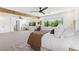 Bright main bedroom with seating area, and large windows providing lots of natural light at 7360 Dolphine Crest Ave, Las Vegas, NV 89129