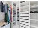 Walk-in closet with custom shelving, drawers, and ample storage space for organization at 7360 Dolphine Crest Ave, Las Vegas, NV 89129