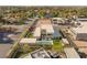 Aerial view of an expansive property with a modern home, pool, sauna, basketball court, and lush landscaping at 7385 Heron Canyon Ct, Las Vegas, NV 89117