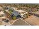 An aerial view showcases a modern home with a basketball court, lush landscaping, and a spacious layout at 7385 Heron Canyon Ct, Las Vegas, NV 89117