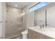 Sleek bathroom featuring a glass enclosed shower and modern vanity with plenty of natural light at 7385 Heron Canyon Ct, Las Vegas, NV 89117