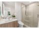 Modern bathroom features glass shower, and sleek vanity with lots of bright natural light at 7385 Heron Canyon Ct, Las Vegas, NV 89117