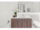 Modern half bathroom featuring a sleek vanity, stylish fixtures, and minimalist design elements at 7385 Heron Canyon Ct, Las Vegas, NV 89117