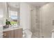 This modern bathroom features a glass-enclosed shower, sleek vanity, and stylish fixtures, offering a spa-like experience at 7385 Heron Canyon Ct, Las Vegas, NV 89117