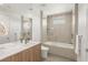 Bright bathroom featuring a double sink vanity, a shower/tub combo and modern fixtures at 7385 Heron Canyon Ct, Las Vegas, NV 89117