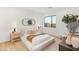 Cozy bedroom featuring wood floors, a large window and neutral decor at 7385 Heron Canyon Ct, Las Vegas, NV 89117