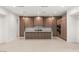 Modern kitchen featuring stylish cabinetry, a large island, and stainless steel appliances in an open layout at 7385 Heron Canyon Ct, Las Vegas, NV 89117