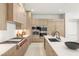 Modern kitchen with a large island, counter seating and premium appliances, ready for gourmet cooking and entertaining at 7385 Heron Canyon Ct, Las Vegas, NV 89117