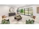 Bright living room with views of the outdoor space through sliding glass doors at 7385 Heron Canyon Ct, Las Vegas, NV 89117